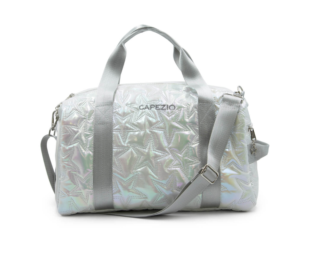 Iridescent metallic star design travel duffle bag with tote shoulder straps, an adjustable and detachable shoulder strap, and a Capezio logo on the side.