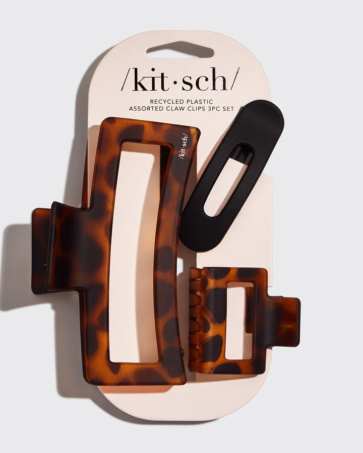 Set of three tortoiseshell and black hair clips in packaging with 'kit-sch' branding.