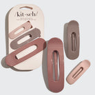 Set of three hair clips in pink and brown neutral hues with 'kit-sch' packaging.